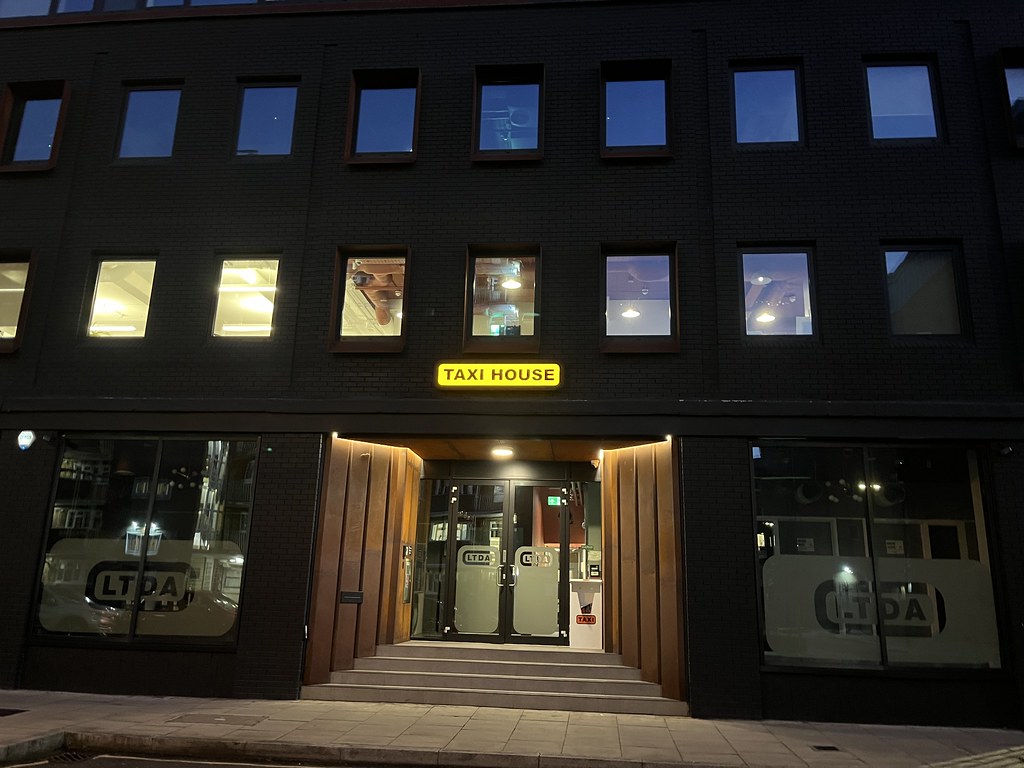 V good sign for a London taxi company office